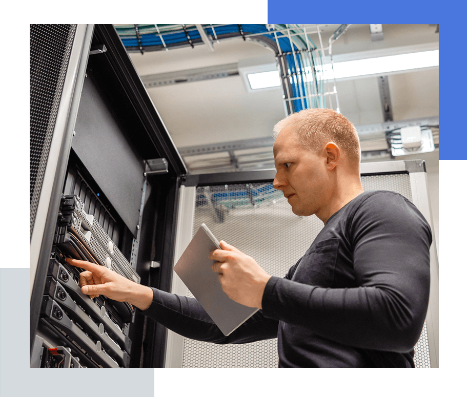 Technician checking server in datacentre